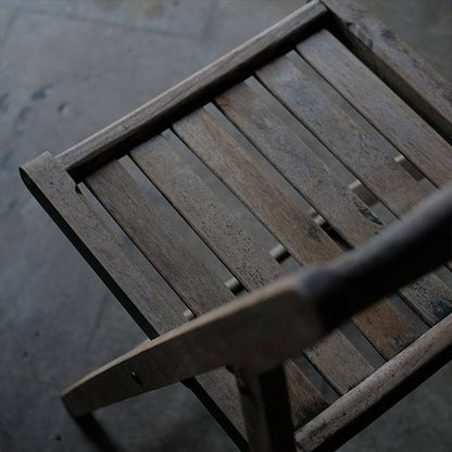 Folding chair with peeling paint