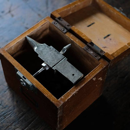 Watchmaker's anvil with wooden box