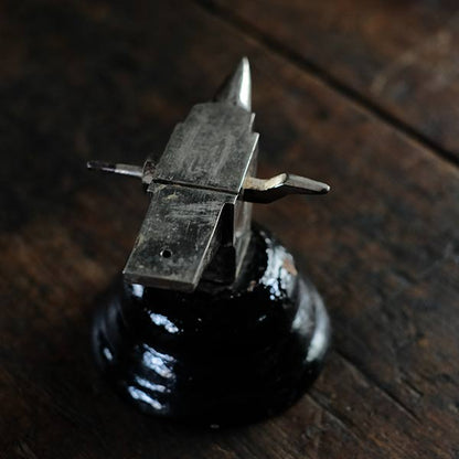 Watchmaker's anvil with wooden box