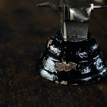 Watchmaker's anvil with wooden box