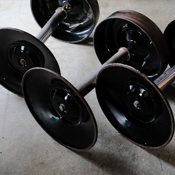 A swivel stool with rusty iron legs