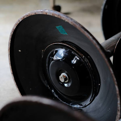 A swivel stool with rusty iron legs