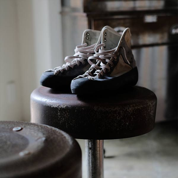 A swivel stool with rusty iron legs
