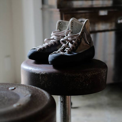 A swivel stool with rusty iron legs