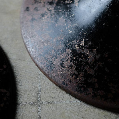 A swivel stool with rusty iron legs