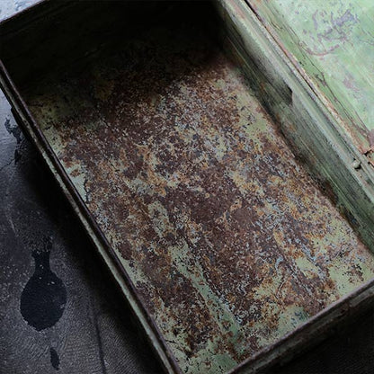 A rusty green trunk
