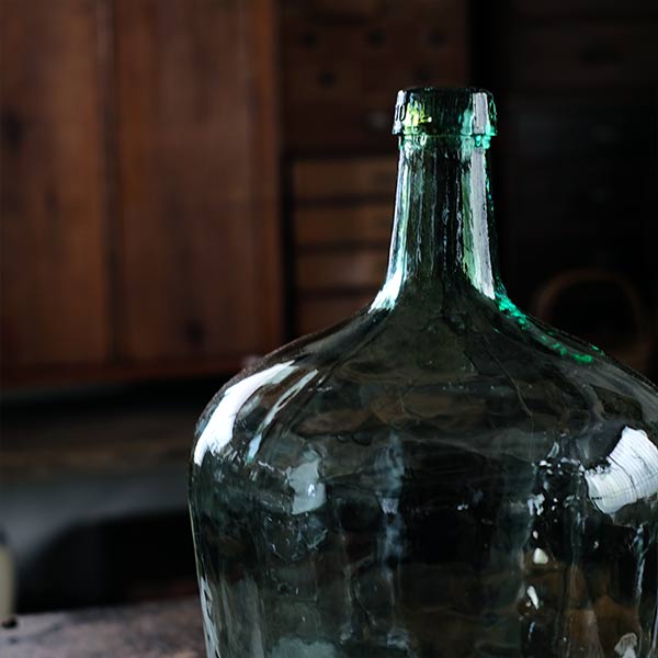 Small sea green demijohn bottle