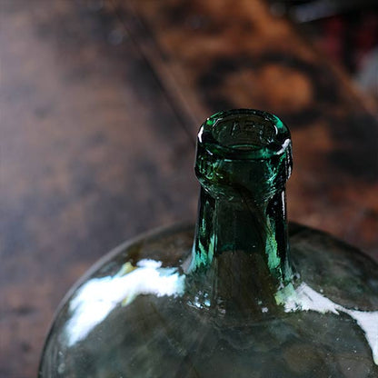 Small sea green demijohn bottle