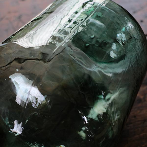 Small sea green demijohn bottle