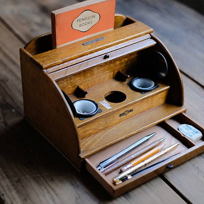 Accordion-style storage box with lid and drawer