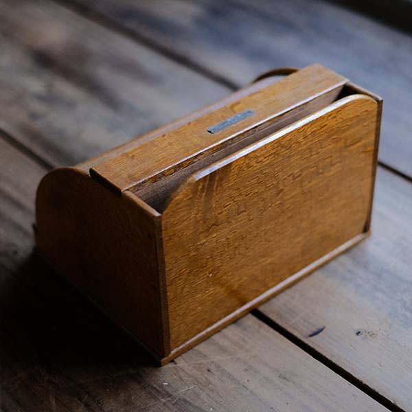 Accordion-style storage box with lid and drawer