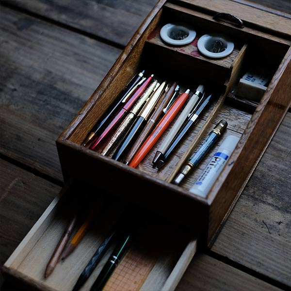 Accordion-style pencil case with drawer