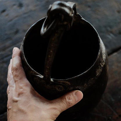 Iron bucket in a well