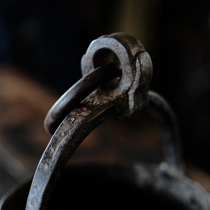 Iron bucket in a well