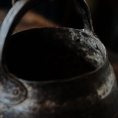 Iron bucket in a well