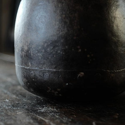 Iron bucket in a well