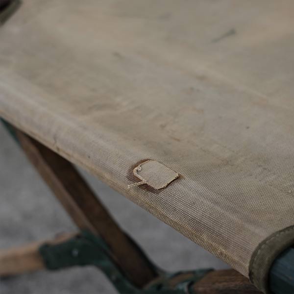 A well-used American folding cot from 1944
