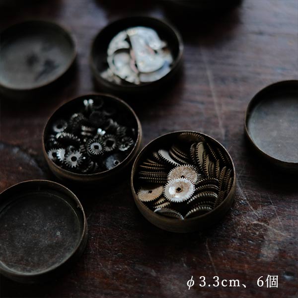 Cans and bottles containing watch parts (85 cans, 85 bottles)