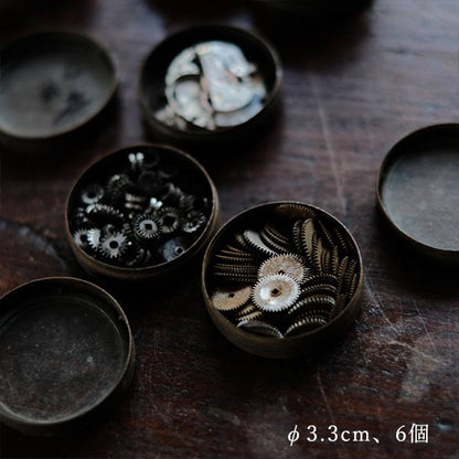 Cans and bottles containing watch parts (85 cans, 85 bottles)