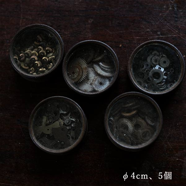 Cans and bottles containing watch parts (85 cans, 85 bottles)