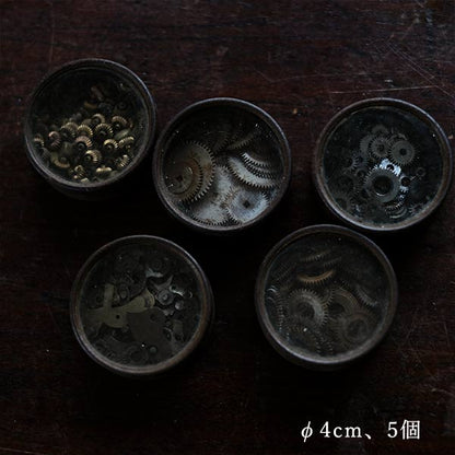 Cans and bottles containing watch parts (85 cans, 85 bottles)
