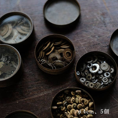 Cans and bottles containing watch parts (85 cans, 85 bottles)