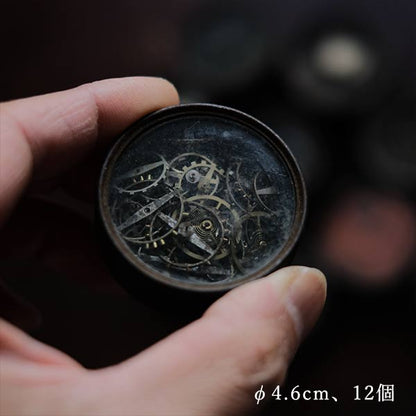 Cans and bottles containing watch parts (85 cans, 85 bottles)
