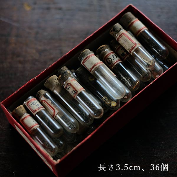 Cans and bottles containing watch parts (85 cans, 85 bottles)