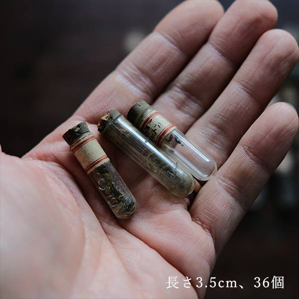 Cans and bottles containing watch parts (85 cans, 85 bottles)