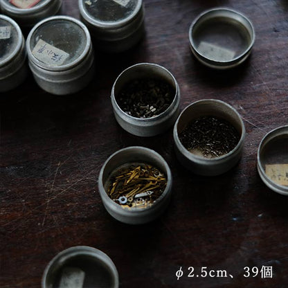 Cans and bottles containing watch parts (85 cans, 85 bottles)