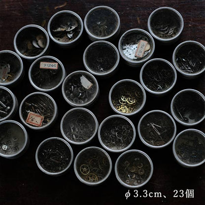 Cans and bottles containing watch parts (85 cans, 85 bottles)