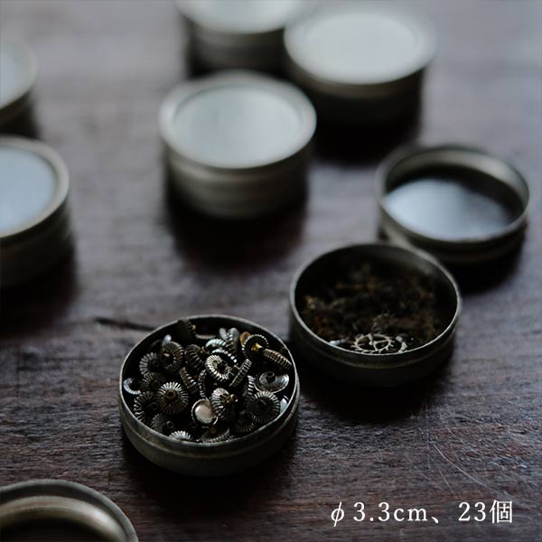 Cans and bottles containing watch parts (85 cans, 85 bottles)