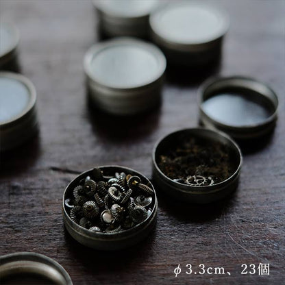 Cans and bottles containing watch parts (85 cans, 85 bottles)