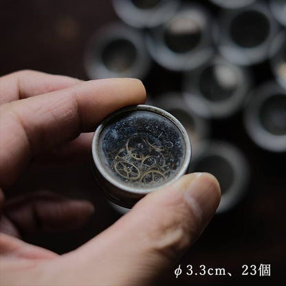 Cans and bottles containing watch parts (85 cans, 85 bottles)