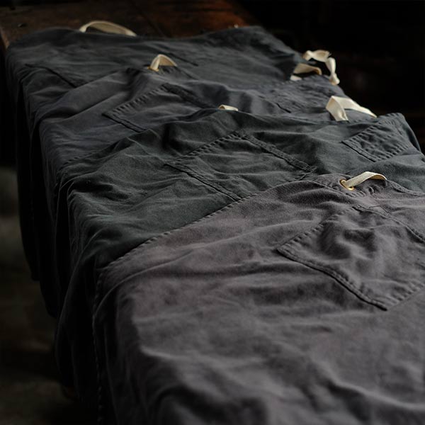 Faded navy blue work apron