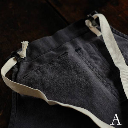 Faded navy blue work apron