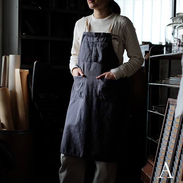 Faded navy blue work apron