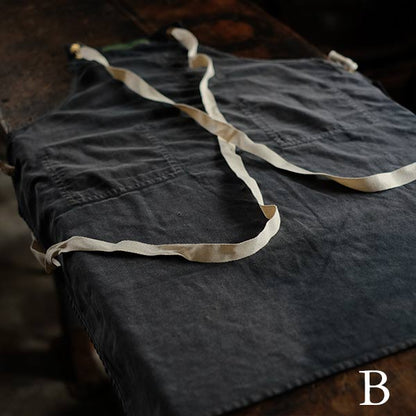 Faded navy blue work apron