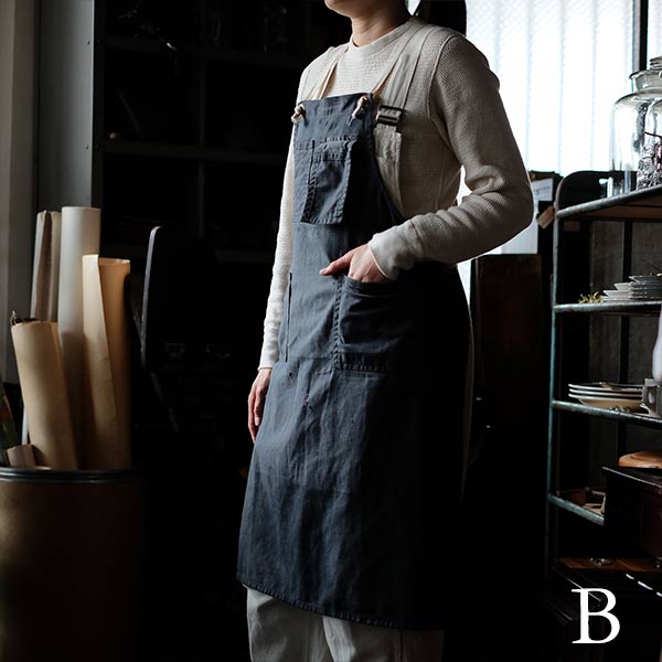 Faded navy blue work apron