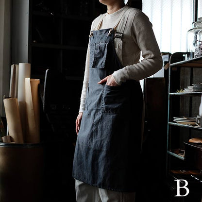 Faded navy blue work apron