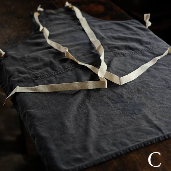 Faded navy blue work apron