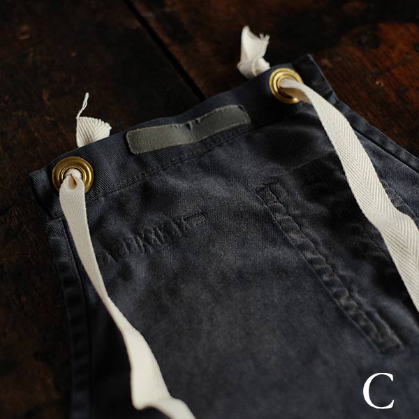 Faded navy blue work apron
