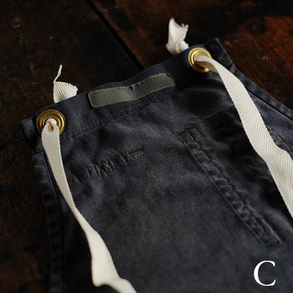 Faded navy blue work apron