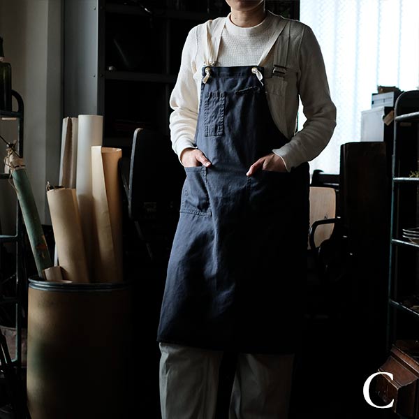 Faded navy blue work apron