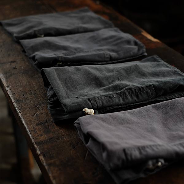 Faded navy blue work apron
