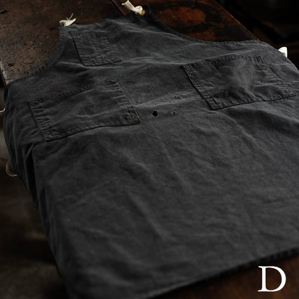 Faded navy blue work apron