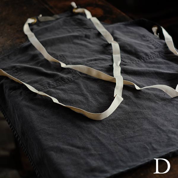 Faded navy blue work apron
