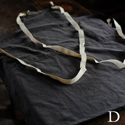 Faded navy blue work apron