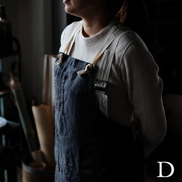 Faded navy blue work apron