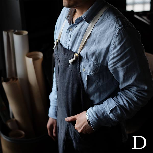 Faded navy blue work apron